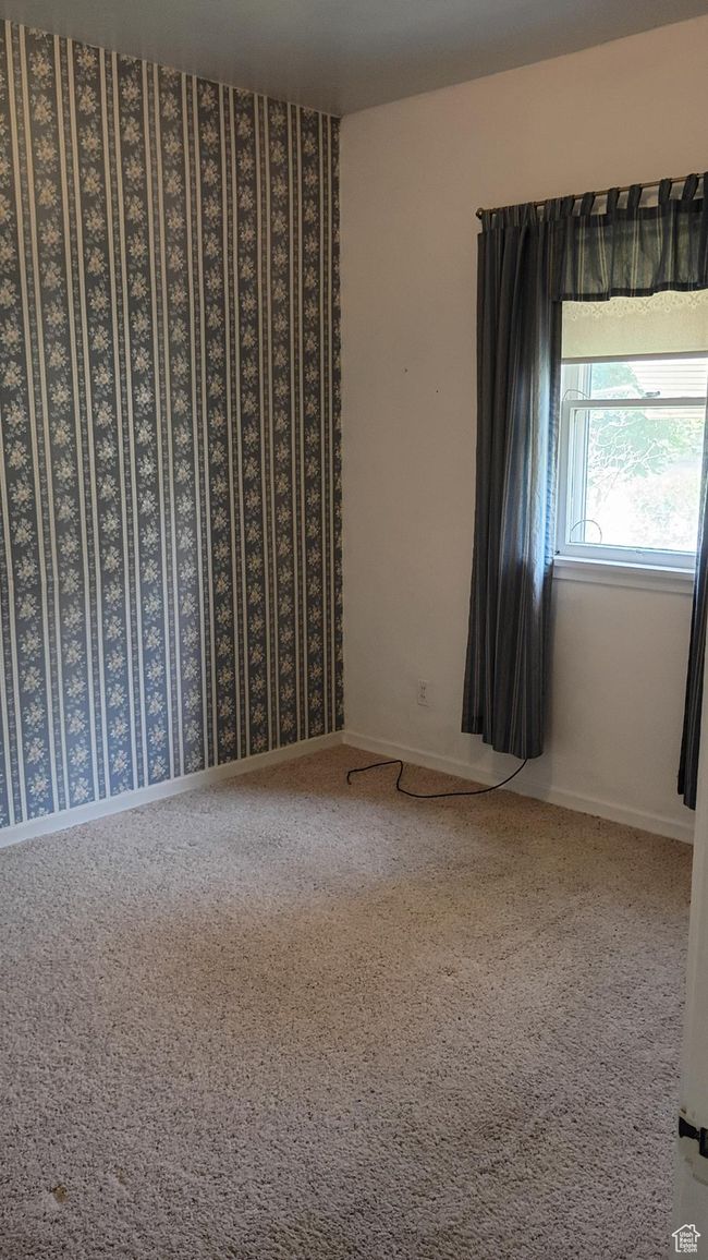 Bedroom featuring light carpet and wallpapered walls | Image 27