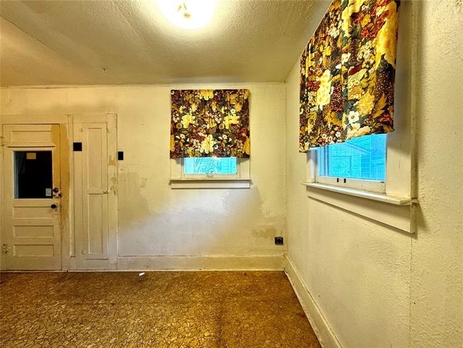 Back room. Door leads to back porch where washer/dryer hookups are located | Image 19