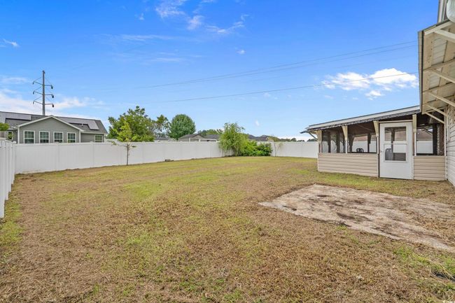 View of yard featuring a sunroom | Image 25