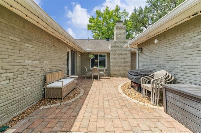 Experience perfect outdoor living with a spacious patio for seating and grilling. | Image 20