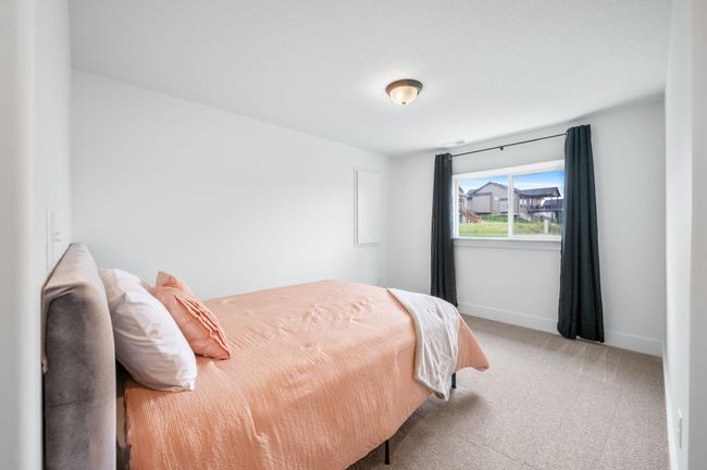 Carpeted bedroom featuring baseboards | Image 30