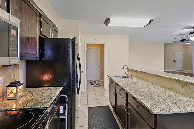 View of Utility Room with Access to Garage | Image 15