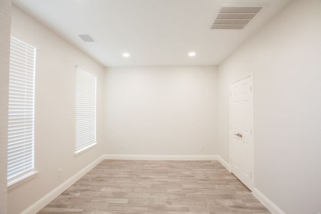 Spare room featuring light wood-style floors and recessed lighting | Image 7