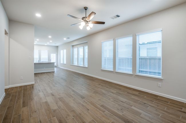 Spare room featuring ceiling fan and light hardwood / wood-style flooring | Image 10
