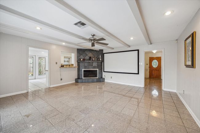 Cozy fireplace and ceiling beams | Image 13