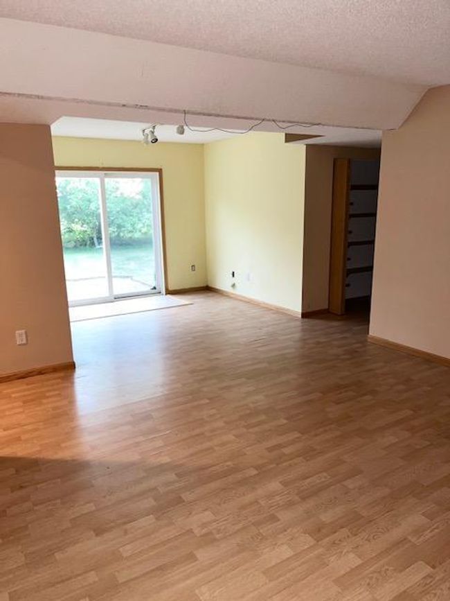 The lower level family room opens onto the paver patio with pergola! Great for all of your entertaining needs! | Image 11