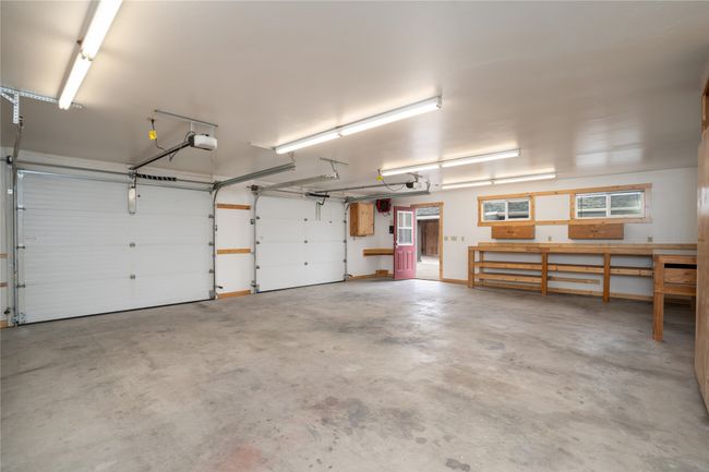 Garage featuring a garage door opener | Image 34