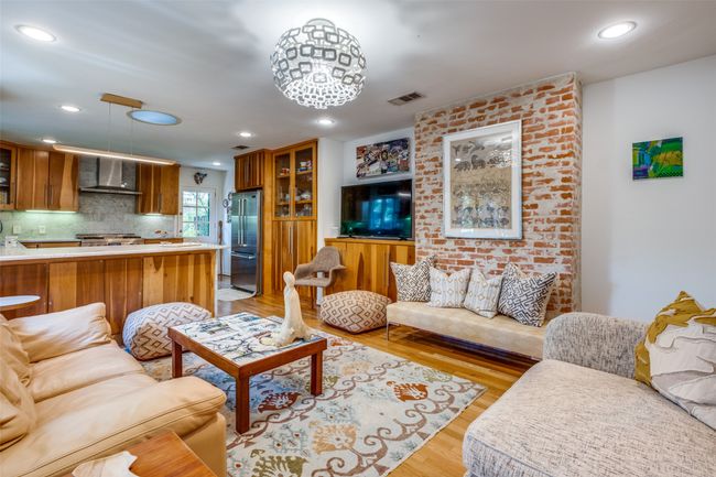 Living room with light hardwood / wood-style floors | Image 8