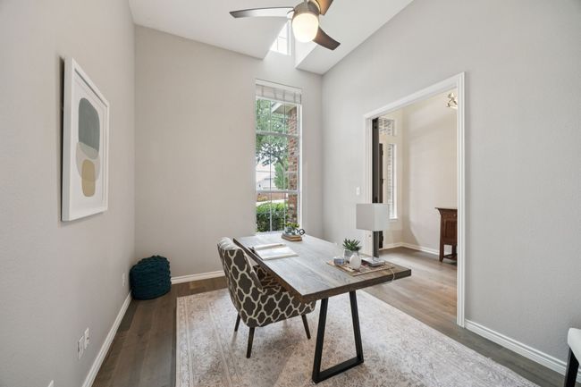 Start and end your day in this bright, spa-like bath featuring a soaking tub under a frosted window and a separate walk-in shower with built-in seating—designed for both relaxation and convenience. | Image 22