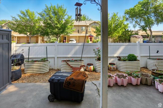 Fenced backyard with a patio area and a residential view | Image 23