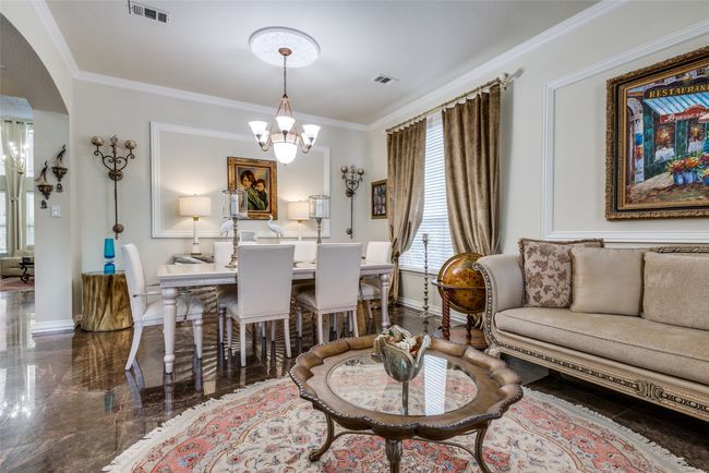 Connected formal living and dining area. | Image 9