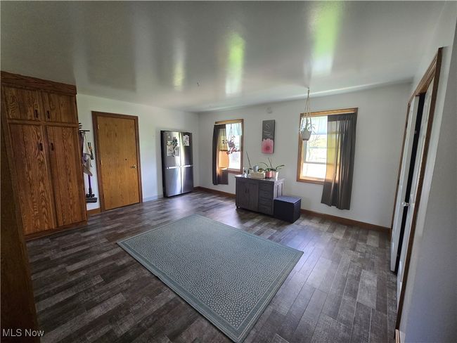 Entryway with dark wood finished floors and baseboards | Image 13