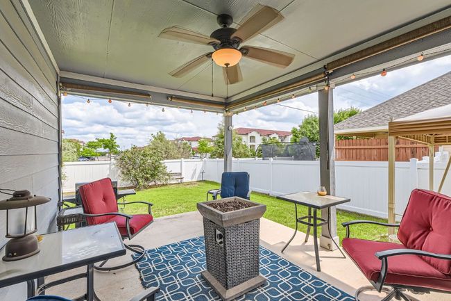 View of patio / terrace with a ceiling fan and a fenced backyard | Image 22