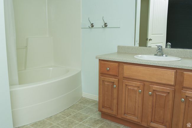 Bathroom featuring vanity and tile patterned flooring | Image 11