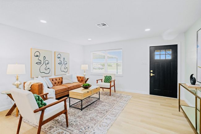 Living room with light wood-style flooring and recessed lighting | Image 6