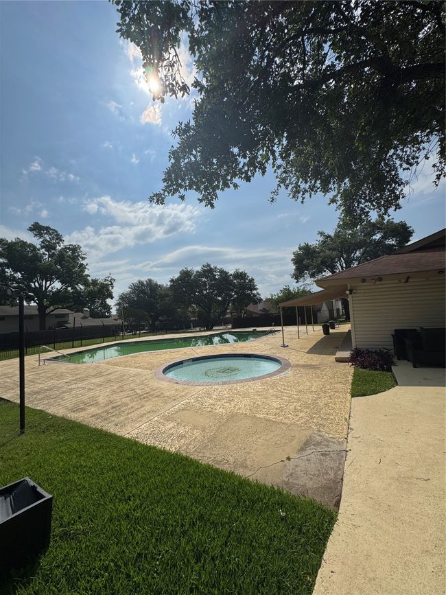 View of pool with an in-ground hot tub and a patio | Image 20