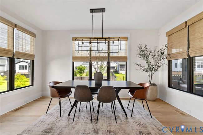 Dining area featuring light wood-style flooring | Image 18