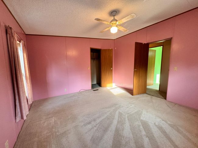 Bedroom #1 has a nice walk in closet | Image 15