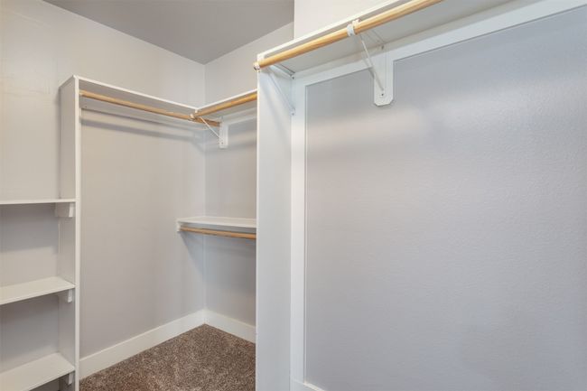 Spacious closet featuring carpet | Image 16