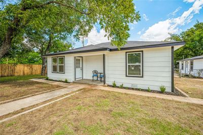 Ranch-style home featuring a front yard | Image 1