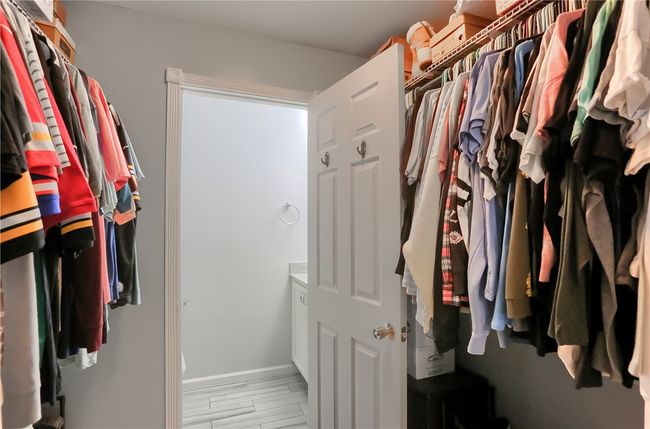 Walk in closet in primary bedroom | Image 22