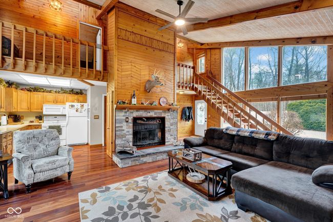 Natural Light, Floor to ceiling Windows and Wood Burning Fireplace. | Image 8