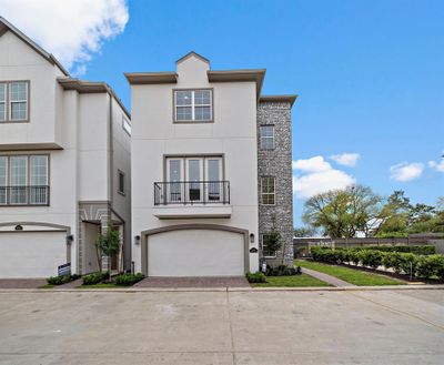 The Claudia plan has a beautiful brick detail and entrance on the side. | Image 3