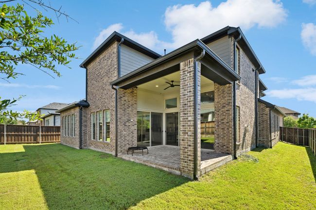 Back of house featuring a patio, ceiling fan, a fenced backyard, and brick siding | Image 38