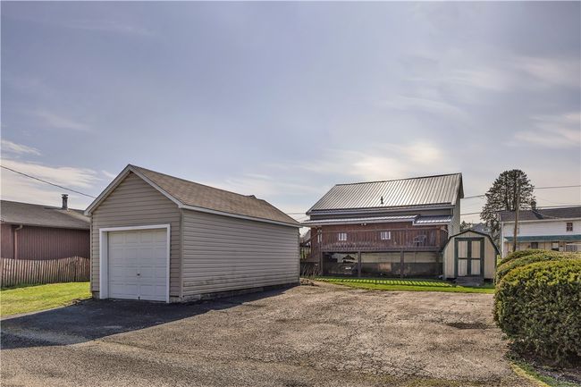 This home offers a 1-car detached garage with two additional off-street parking spots. | Image 5