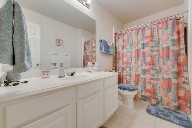 Full bath featuring tile patterned flooring, toilet, and vanity | Image 29