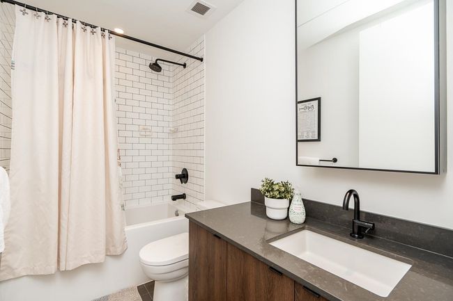 Full bathroom with vanity and shower / bath combination with curtain | Image 20