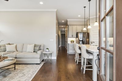 Open Floorplan~Hardwoods throughout~9 ft ceilings on both levels~8 ft doors throught~Oil-rubbed bronze hardware with lever handles throughout. | Image 3