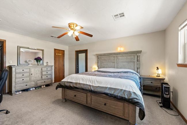 Bedroom featuring carpet flooring and ceiling fan | Image 21