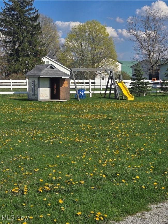 Bike path in the side yard of the home. | Image 47