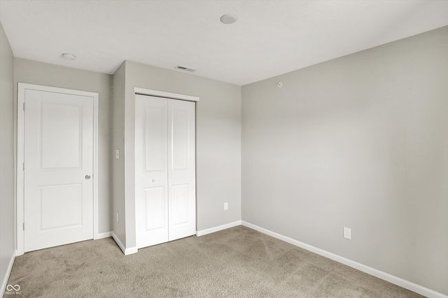 carpeted second bedroom. Rough in for ceiling fan/overhead lighting | Image 28
