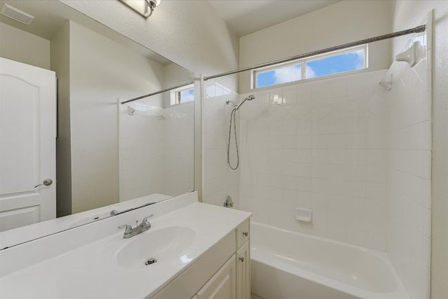 Full bathroom featuring vanity and bathtub / shower combination | Image 15