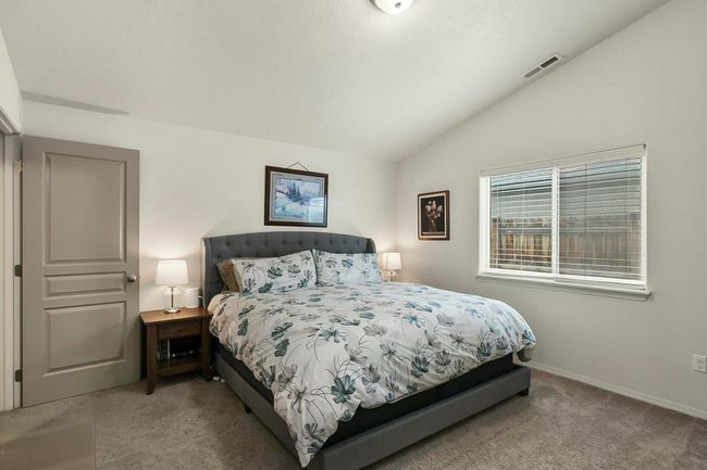 16. Primary Bedroom w/ Vaulted Ceilings | Image 16