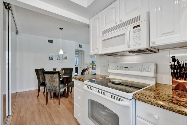 Beautiful granite countertops and plenty of kitchen cabinets | Image 18
