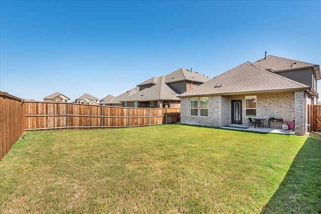 View of yard featuring a fenced backyard and a patio | Image 34