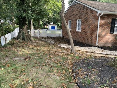 View of left side of the house and landscaped yard | Image 3