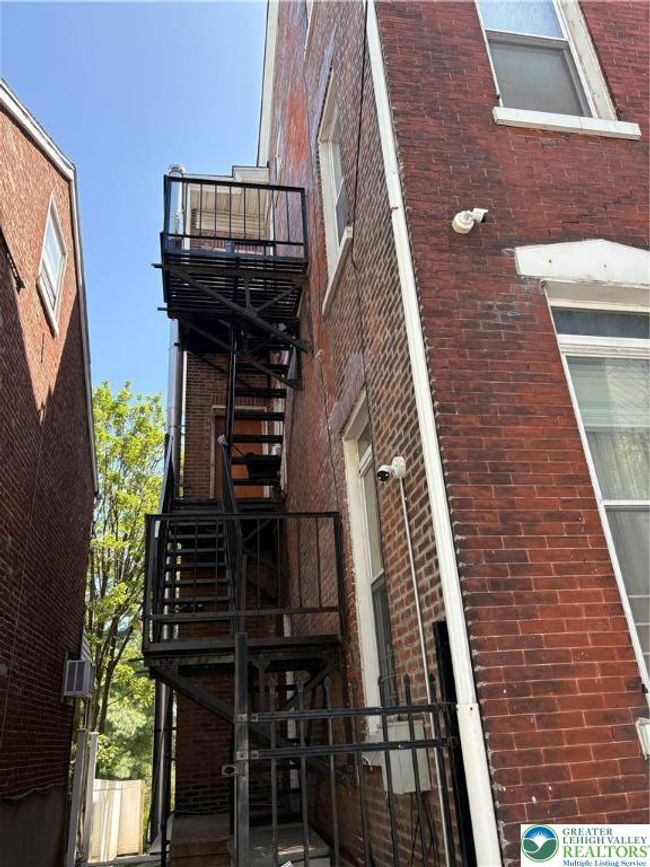Side yard showing fire escape | Image 35