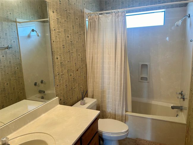 Bathroom with shower / tub combo, toilet, and vanity | Image 19