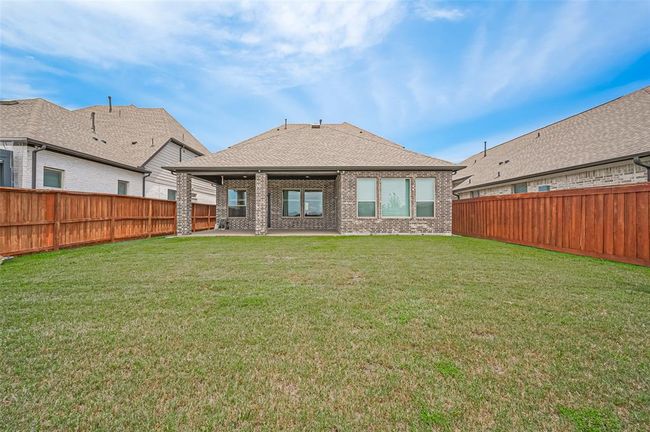 Enjoy outdoor living in a generously sized backyard with no rear neighbors, offering privacy and tranquility | Image 32