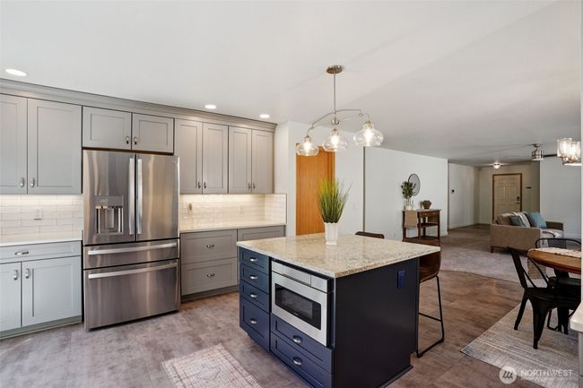 Coffee bar fits perfectly next to the fridge and the island has a GORGEOUS granite top | Image 11
