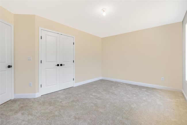 Bathroom featuring marble finish floor, toilet, a stall shower, and visible vents | Image 26