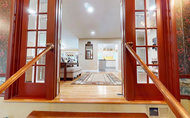 Entrance foyer with wood finished floors, stairs, baseboards, and recessed lighting | Image 25