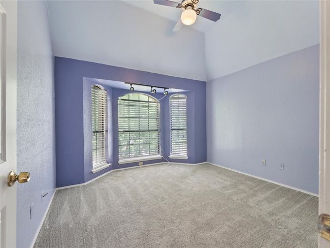 Unfurnished room with carpet, lofted ceiling, and ceiling fan | Image 23