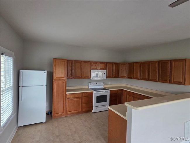Clothes washing area with baseboards and laundry area | Image 20