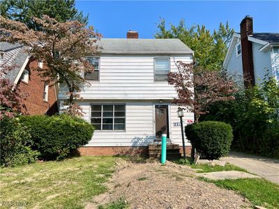 View of front facade with a front lawn | Image 1