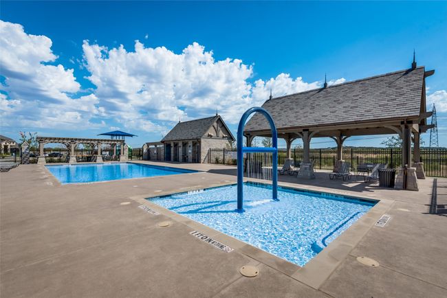 View of swimming pool featuring a patio area | Image 21